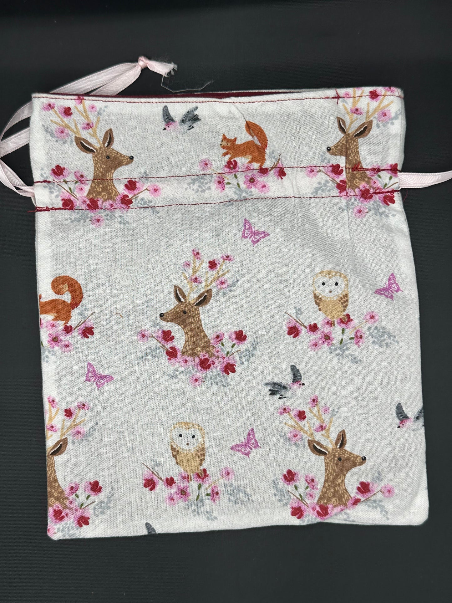 Embroidered butterfly draw string bag
