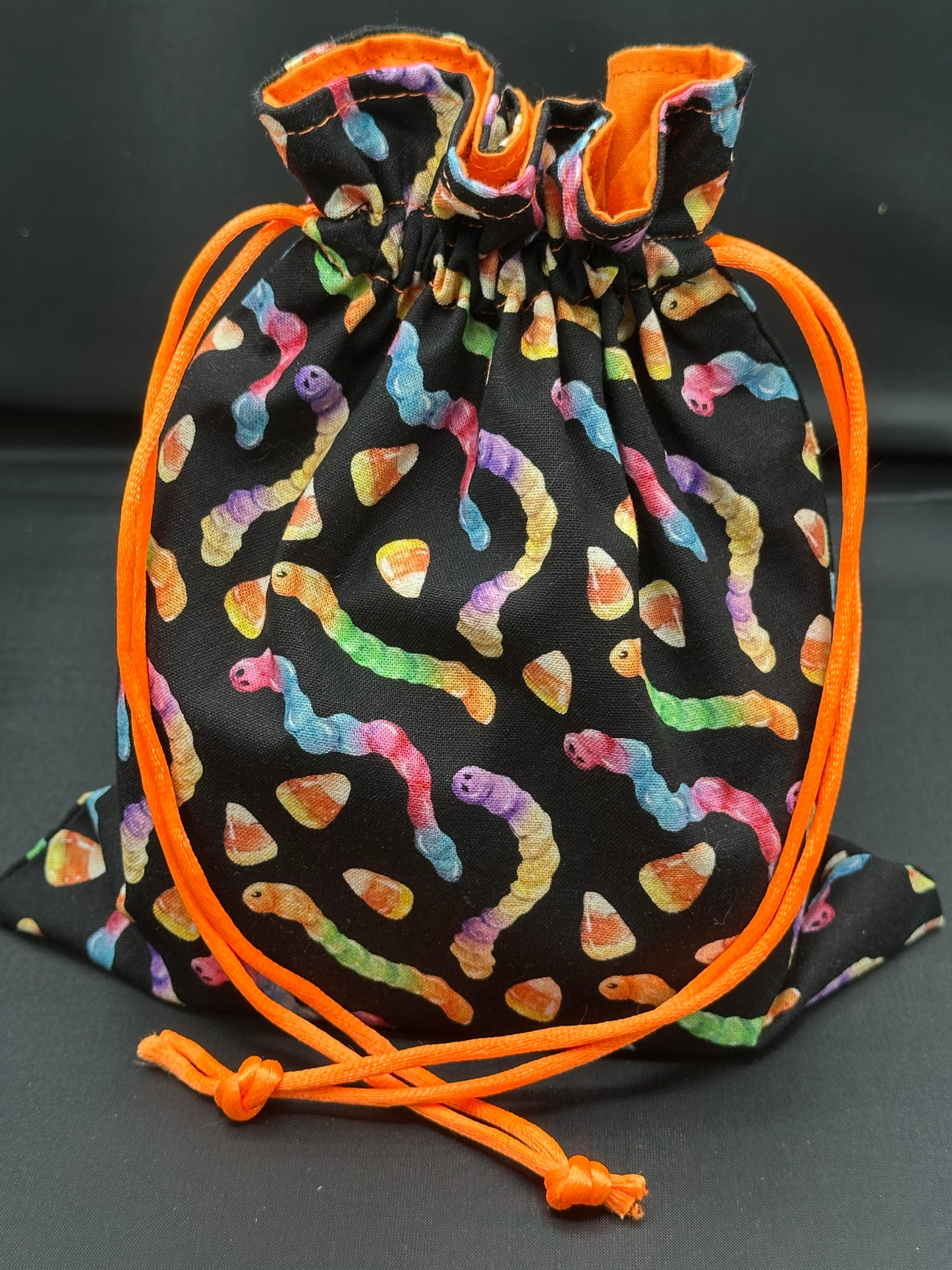 Neon gummy worms draw string bag