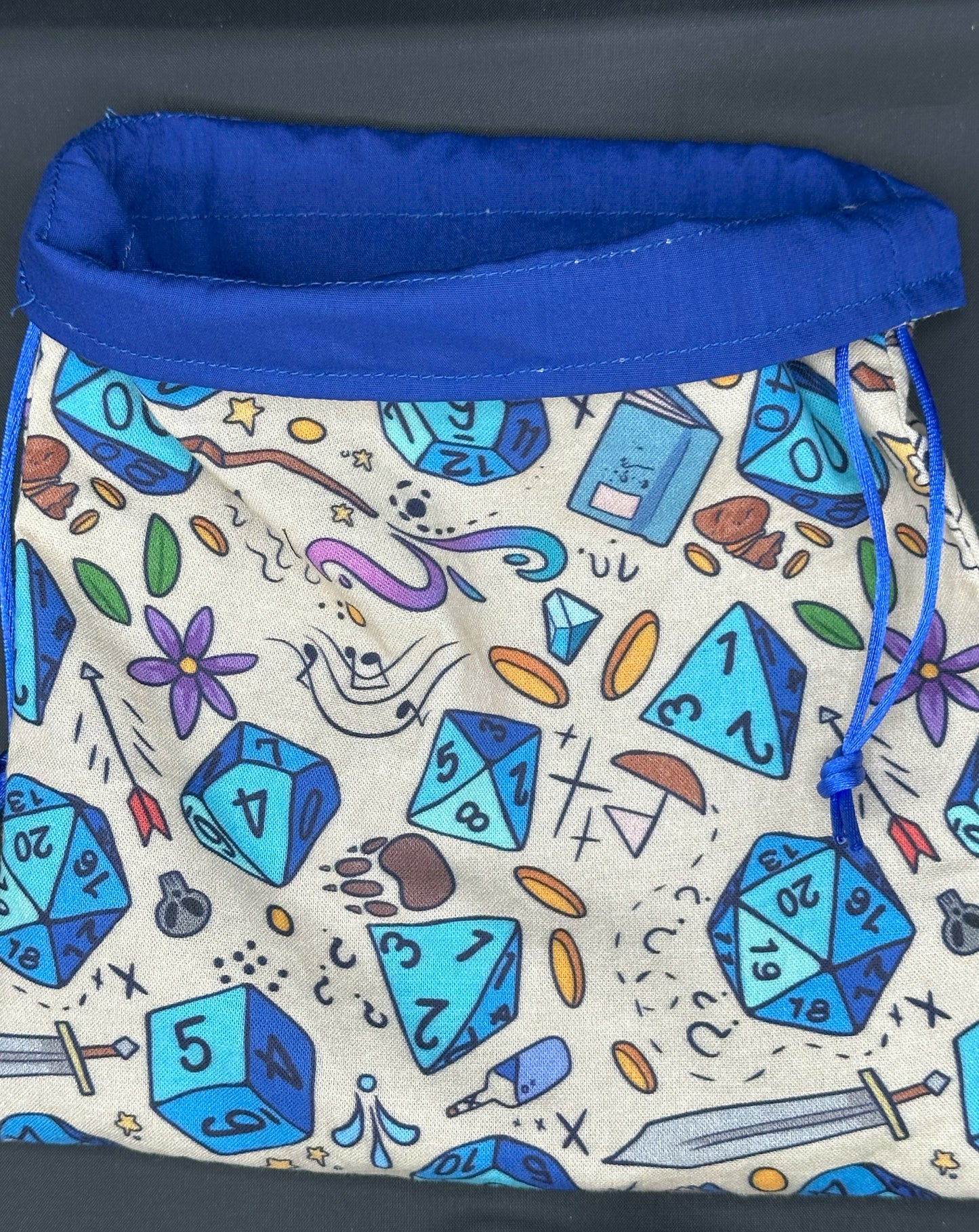 D&D Dice on tan draw string bag