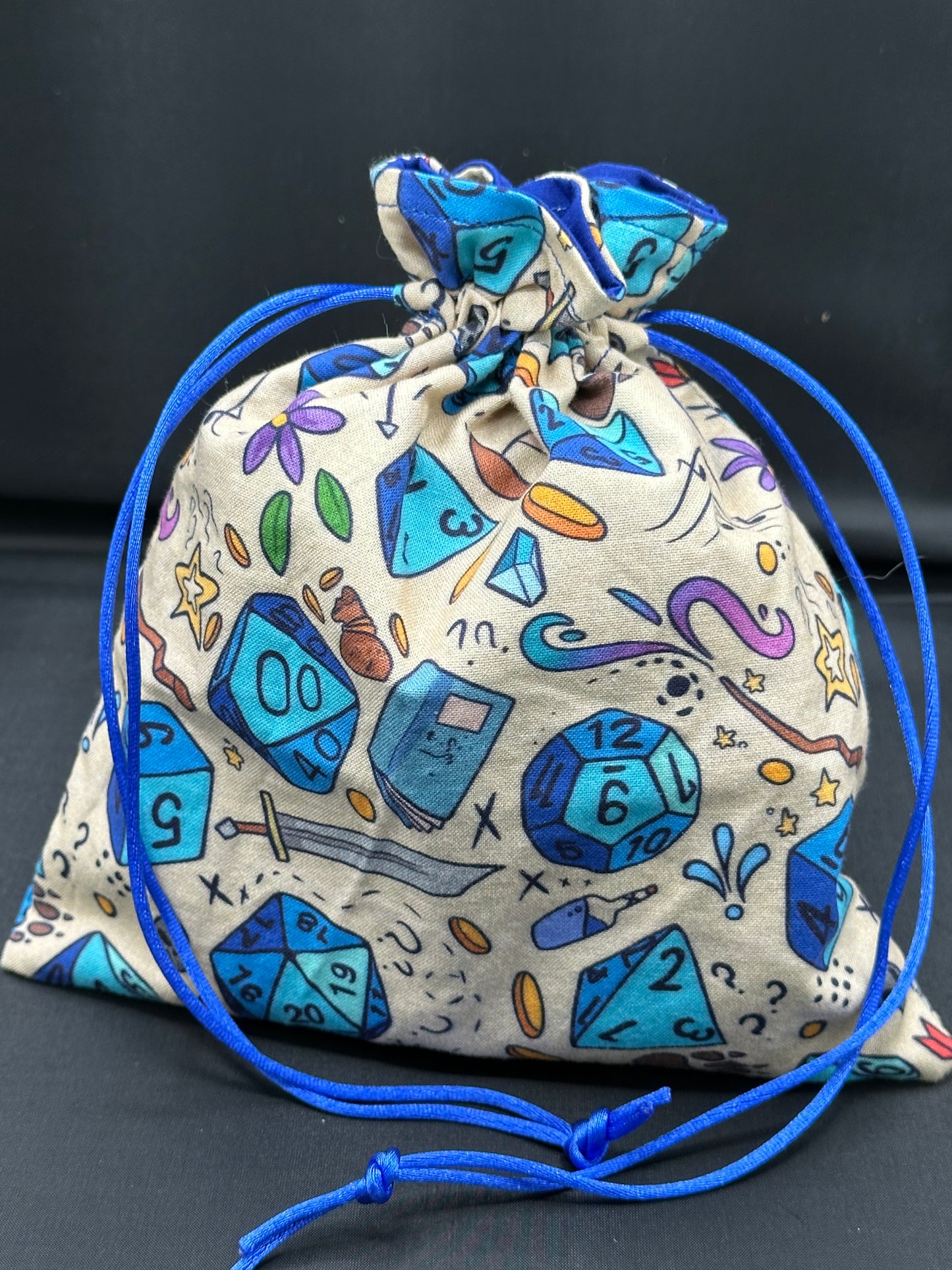 D&D Dice on tan draw string bag