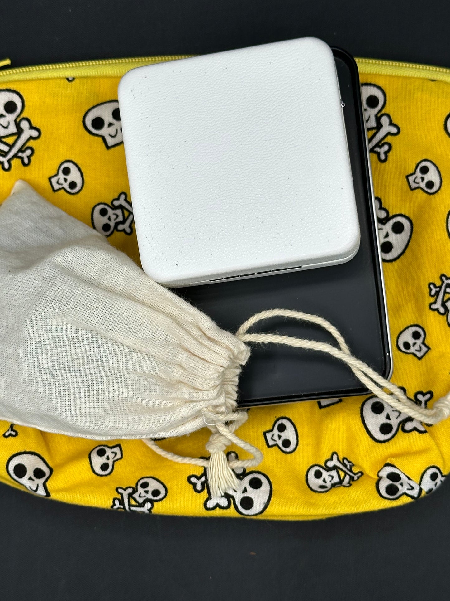 black skull and cross bones on yellow