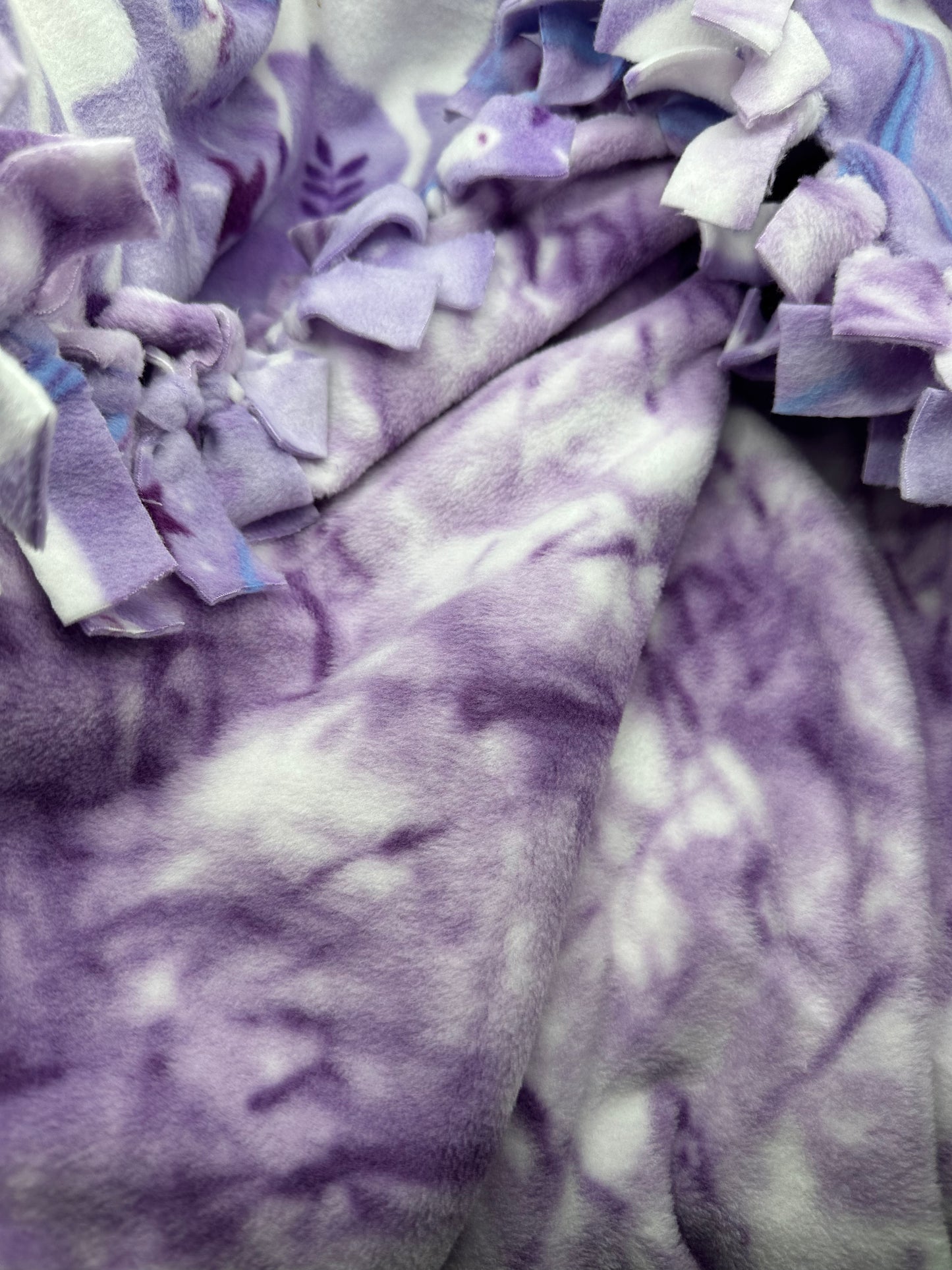 unicorns on purple fleece blanket