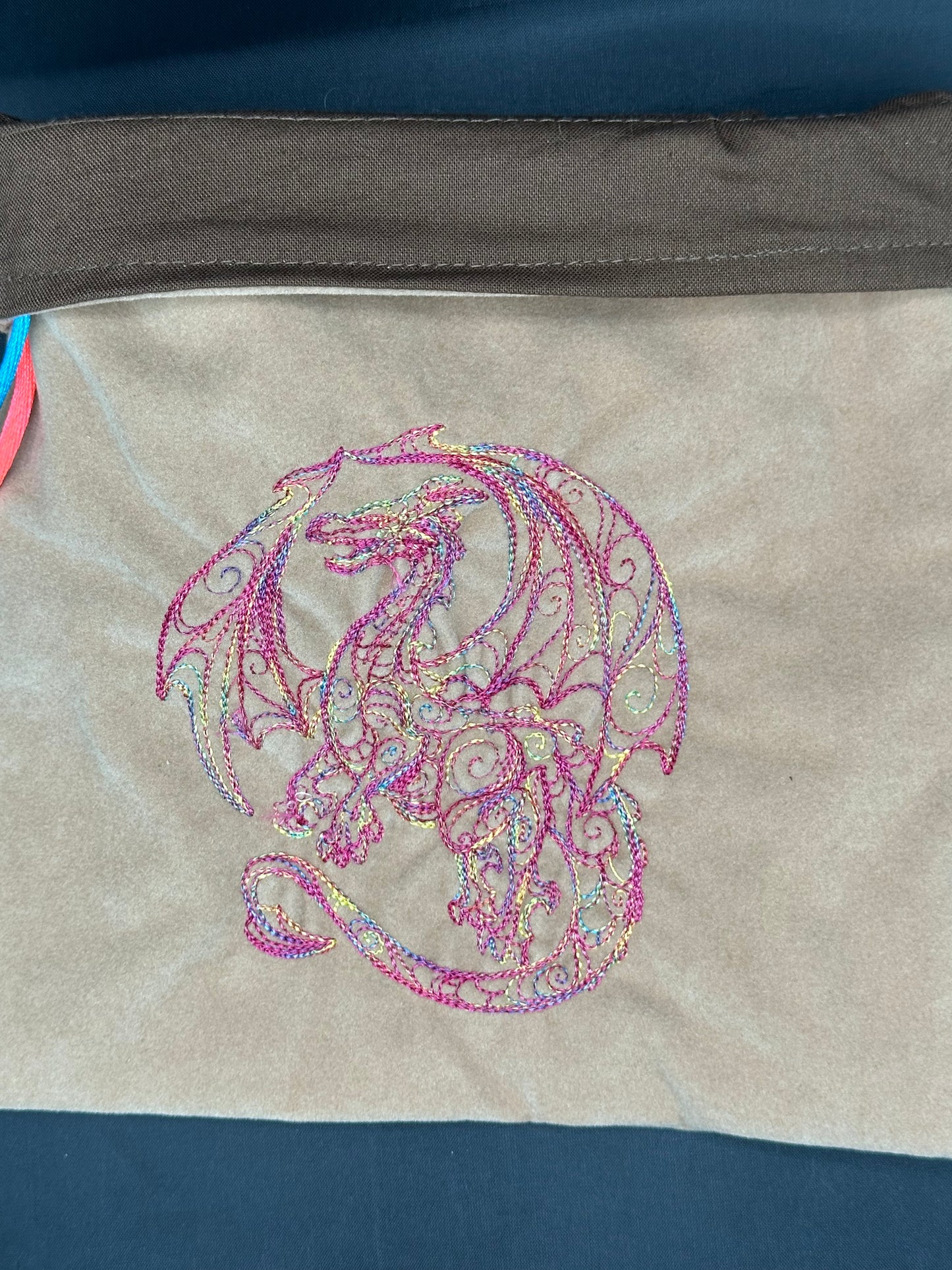 Embroidered doodle dragon draw string bag