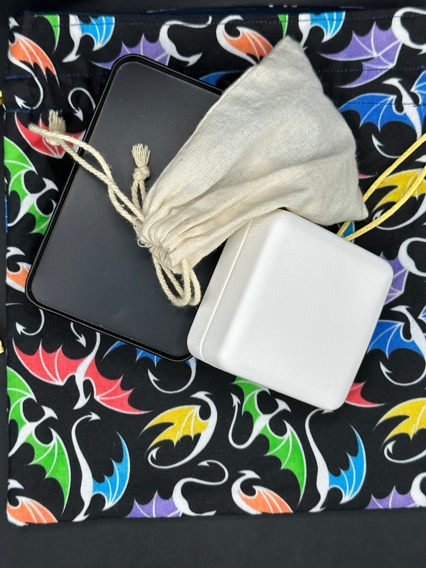multi colored dragons on black draw string bag