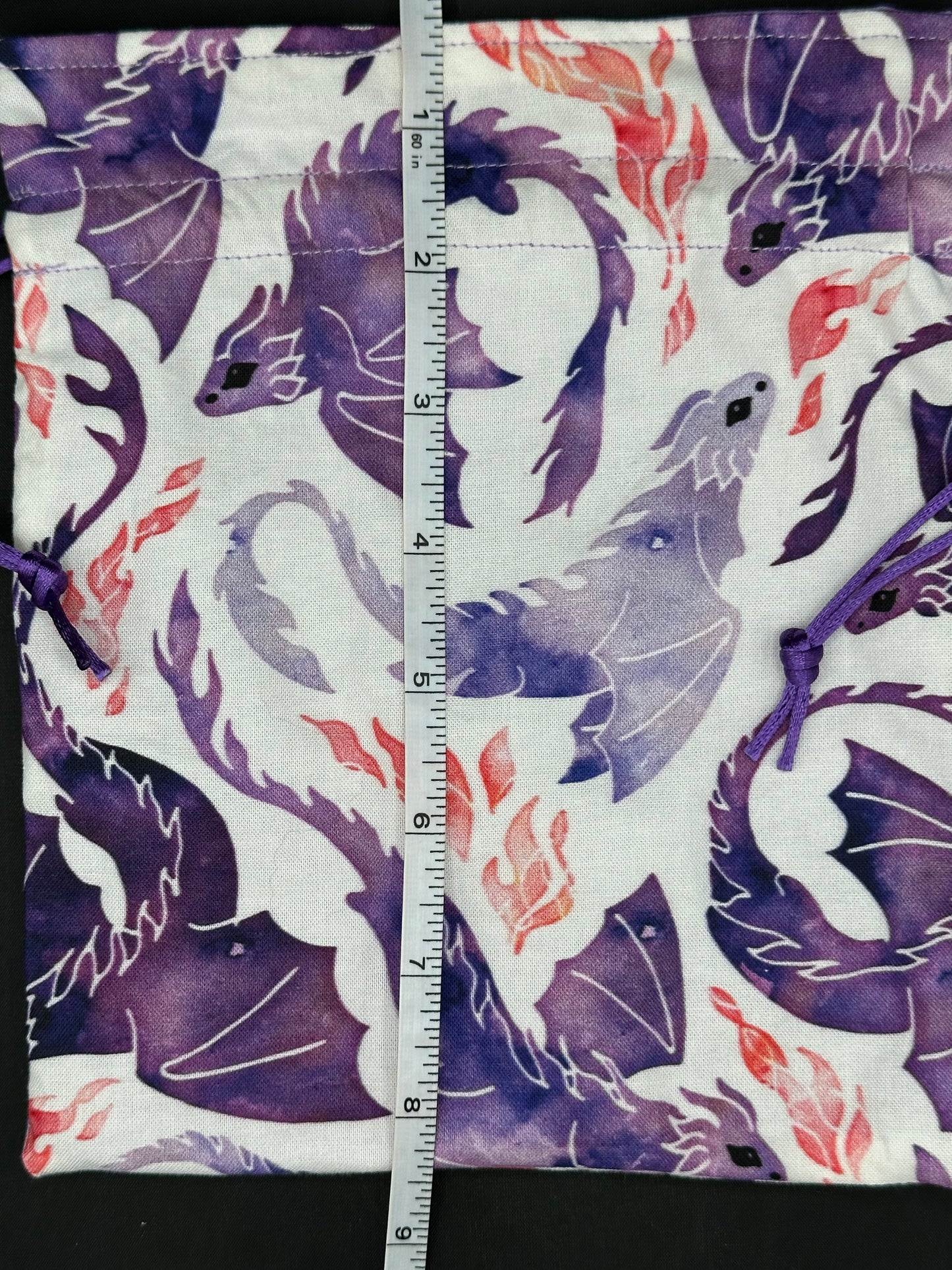 purple dragons on white draw string bag