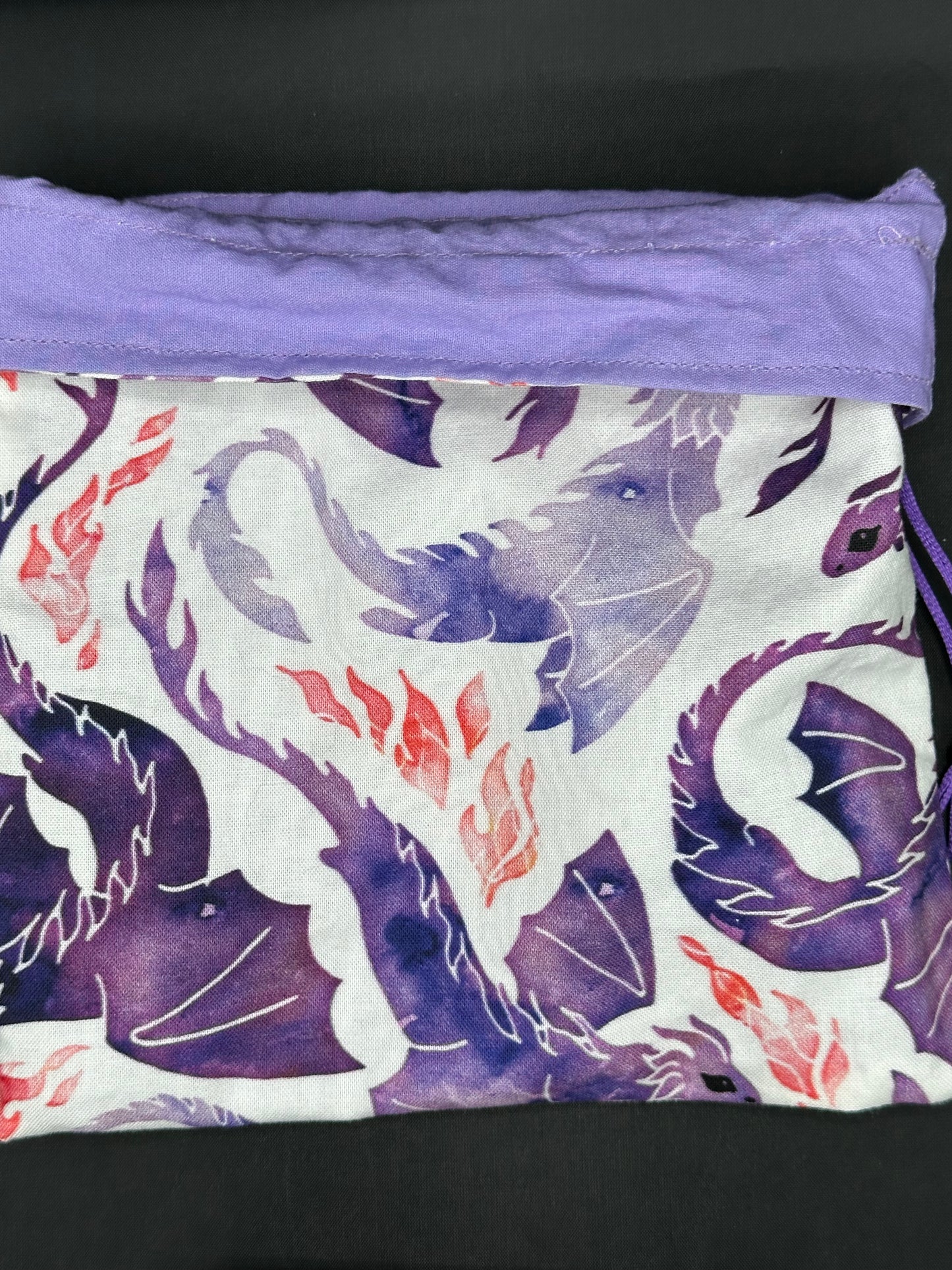 purple dragons on white draw string bag