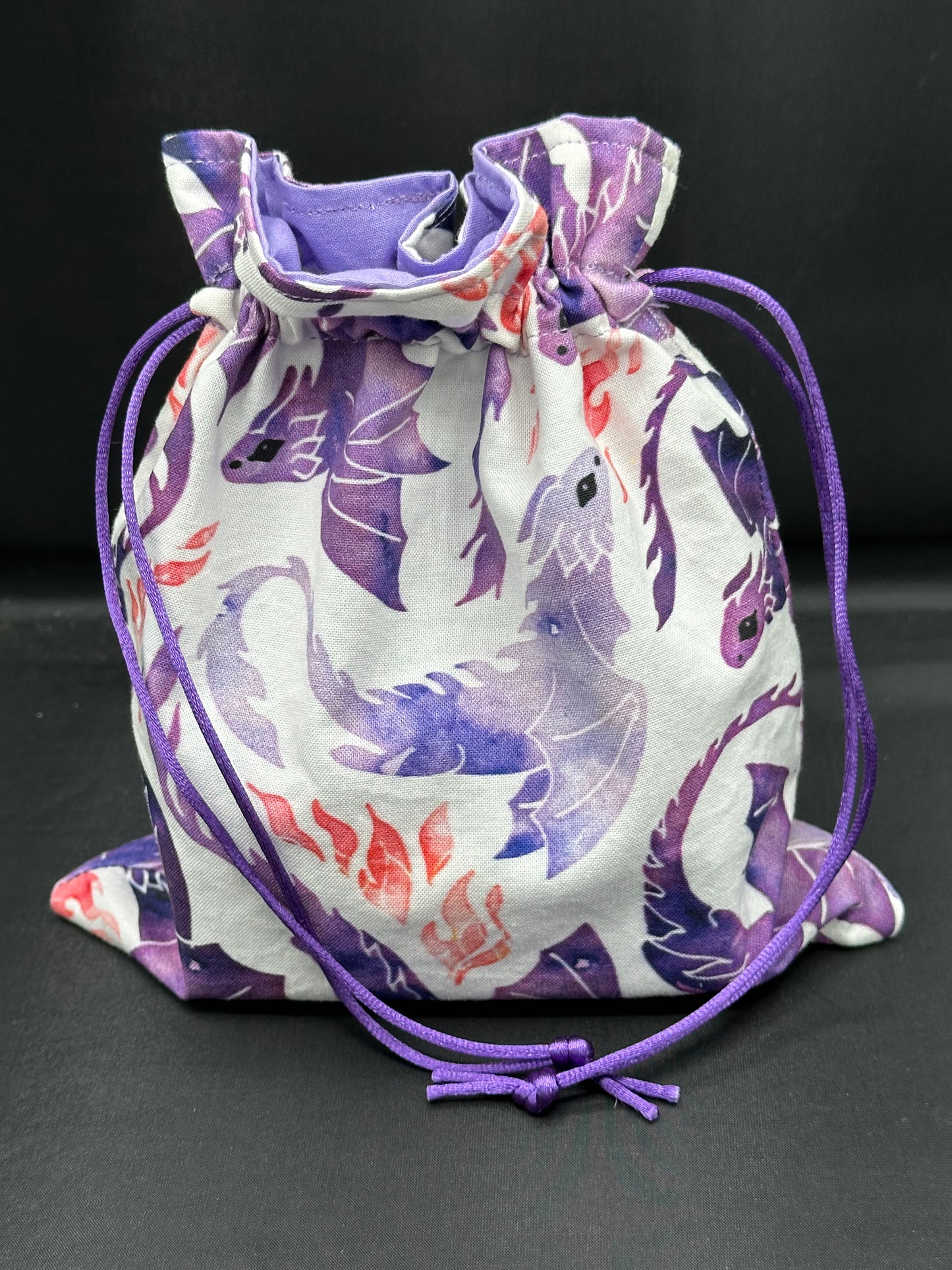 purple dragons on white draw string bag