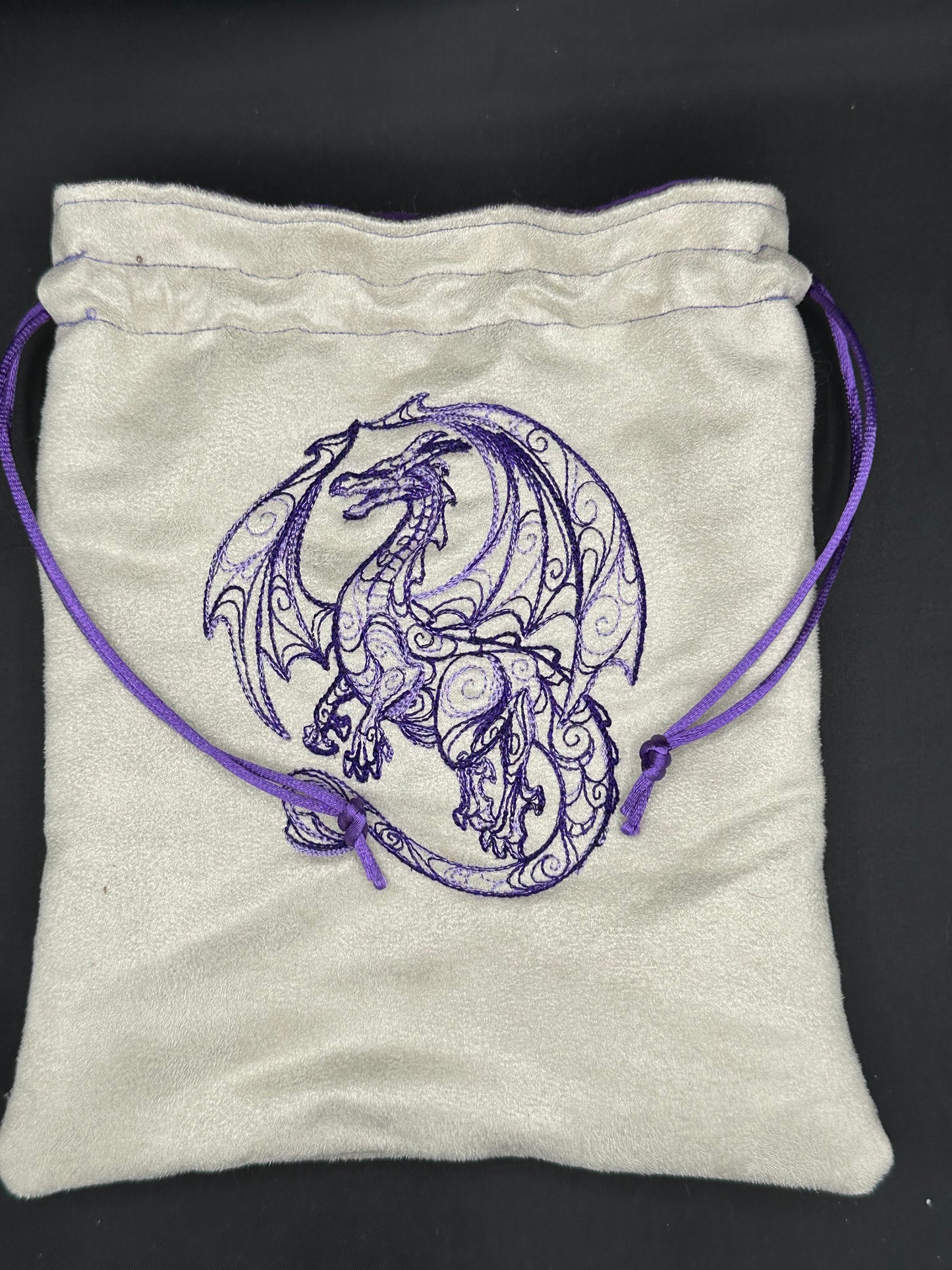 Embroidered doodle dragon draw string bag