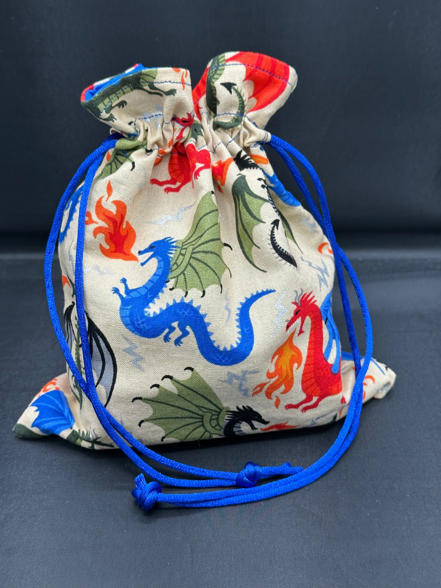 Colorful dragons on tan - drawstring