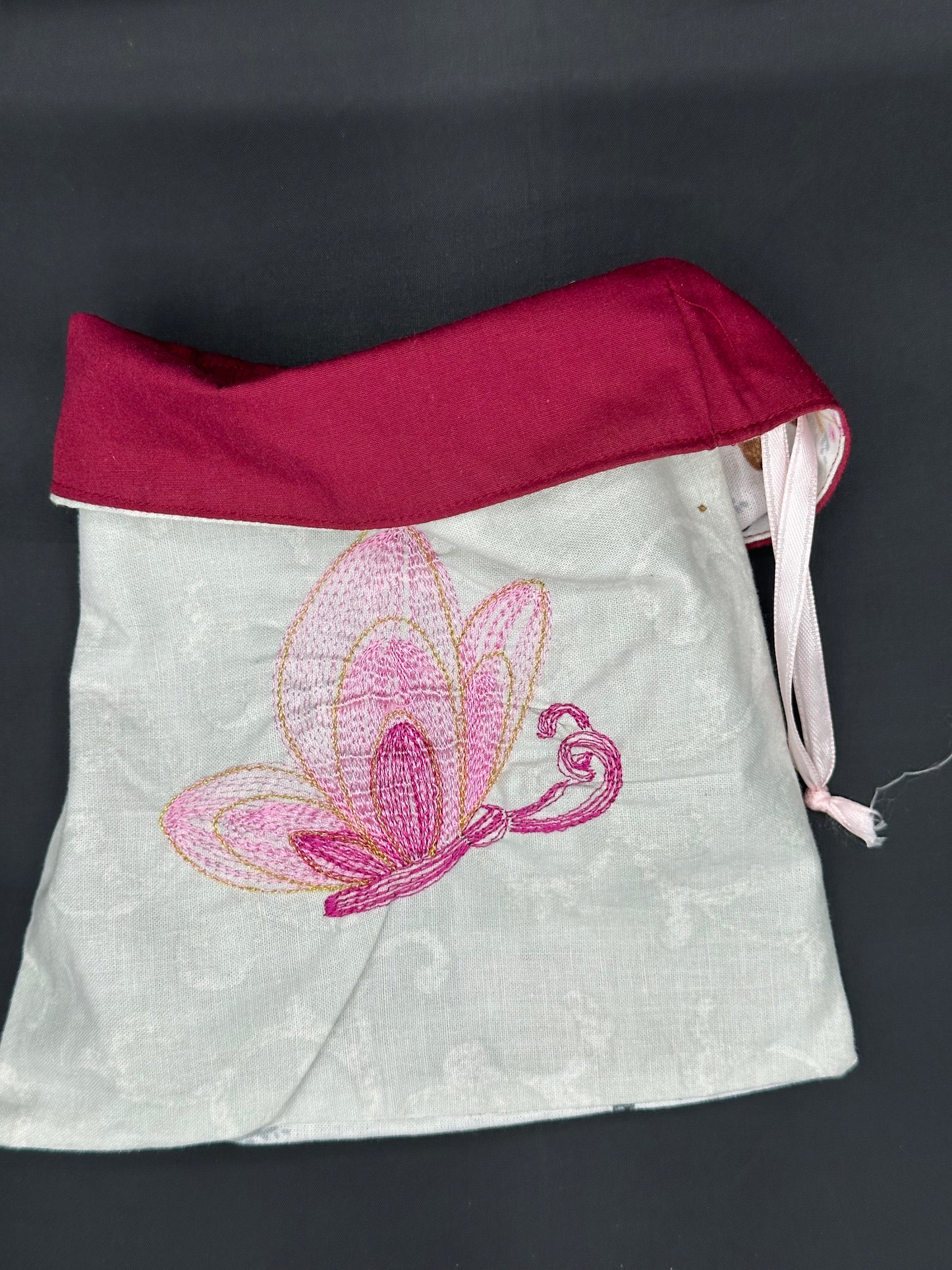 Embroidered butterfly draw string bag