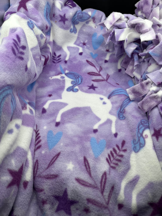unicorns on purple fleece blanket