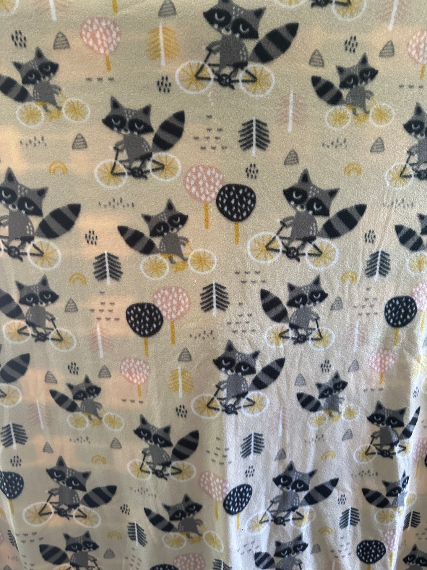raccoons on bikes fleece blanket